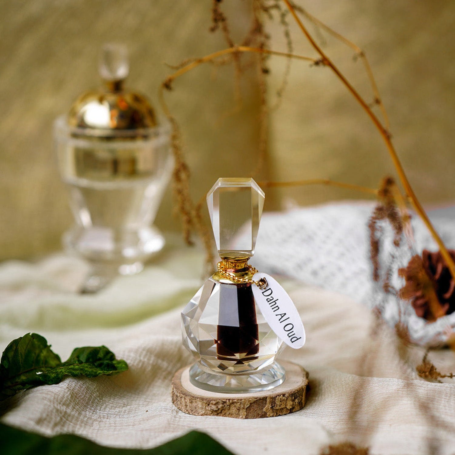 Handmade oud crystal bottle displayed with elegant decor